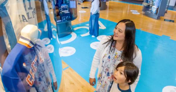 Fans looking at an exhibit at the Carolina Basketball museum