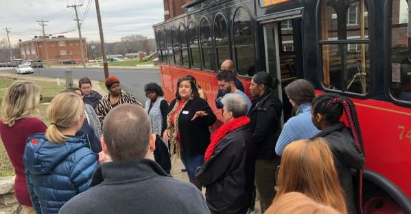 Woman giving historic tour to several visitors