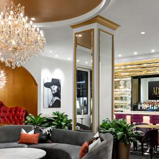 Ornate room with sectional seating and a bar