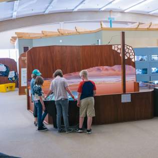 Family and child at an Science Zone exhibit in Casper, WY