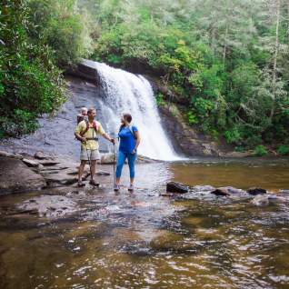 Hikers near waterfall