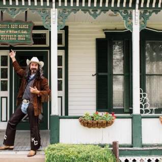 buffalo bill standing outside a house