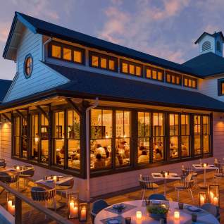 Restaurant exterior lit up at night