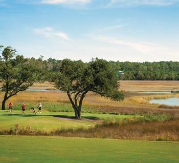 Foursome on Rivers Edge Golf Club's 9th green.