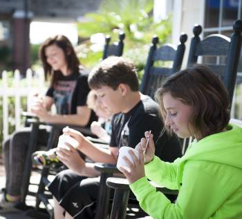 Children enjoying ice cream at the beach