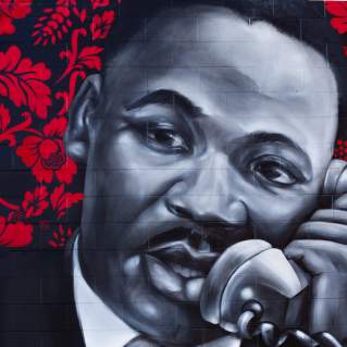 Close up of mural showing MLK talking on a phone