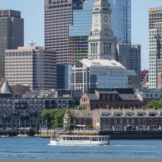 Charles Riverboat cruise in front of Custom House Tower