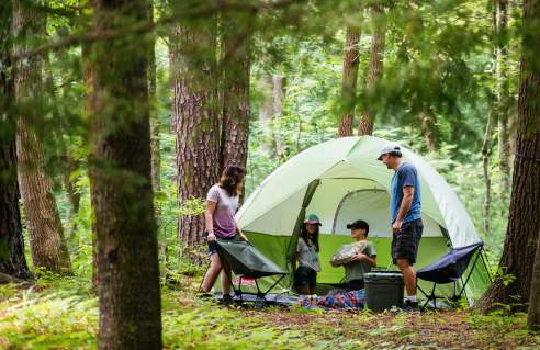 Family camping outdoors