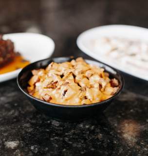 Three entrees displayed on black countertop.