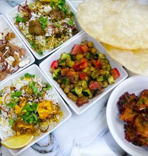 entree items on marble table from bengal kitchen restaurant in rapid city, sd