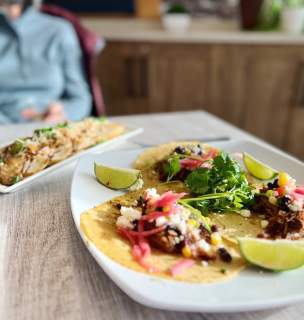 Taco plate and appetizer plate displayed on table.