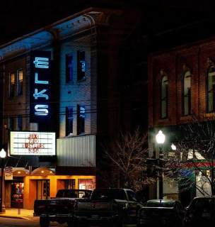elks movie theatre sign and entrance lit up at night in downtown rapid city south dakota