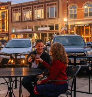 couple enjoying beers on the patio of firehouse brewing company in downtown rapid city south dakota