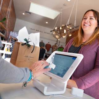 Woman making a purchase at a boutique