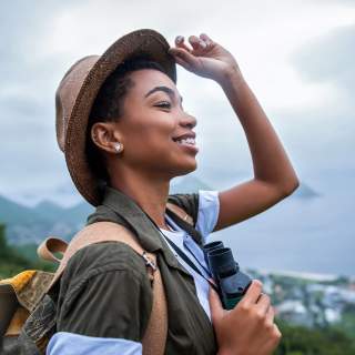 Portrait of young afro woman explorer