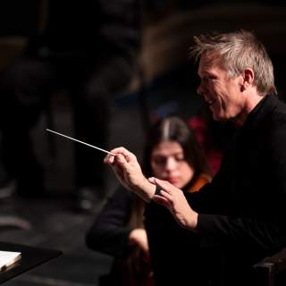 Conductor & Orchestra performing