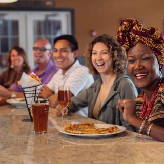 Group Laughing at Bar