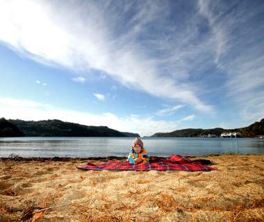 Child on beach at Rosfjord Lyngdal