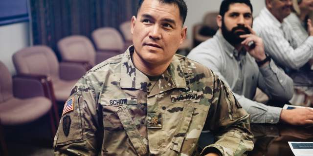 military man at a meeting