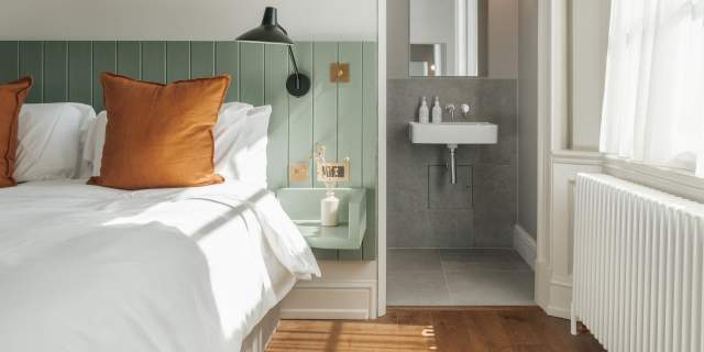 Constantine House bedroom with view into bathroom