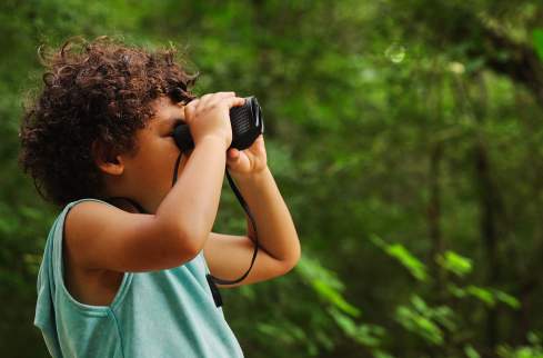 Boy - binoculars side view
