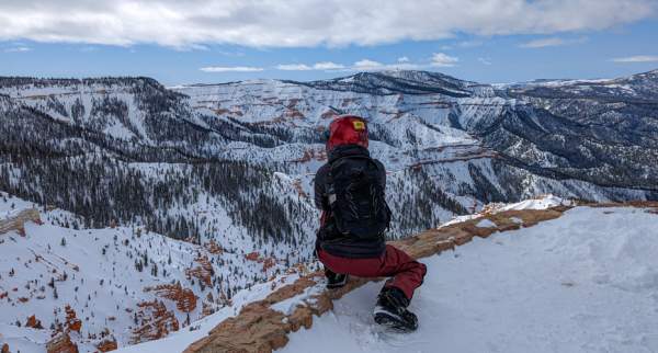 Looking out at the red rock formations of Cedar Breaks National Monument  dusted in snow from the Northern Overlook.