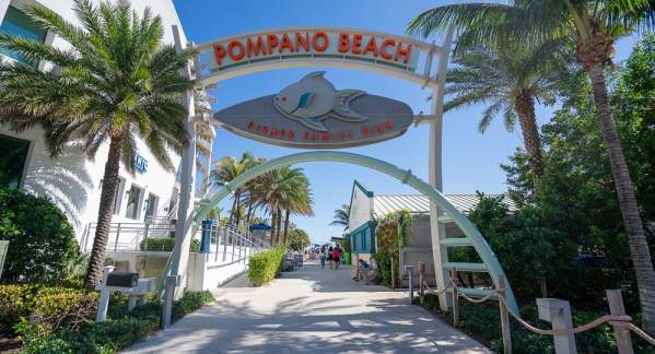 An archway at the entrance to the Pompano Beach Fisher Family Pier.