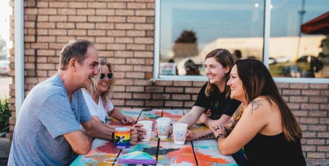 people sitting outside with drinks