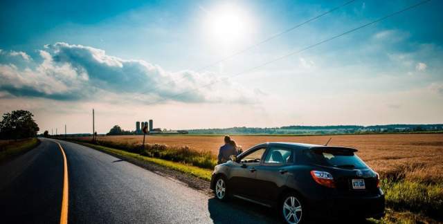 Couple enjoying nature next to the road