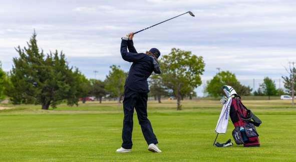 Someone preparing to hit a golfball at a Gold tournament at the Salina Municipal Golf Course. Located in Salina, Kansas