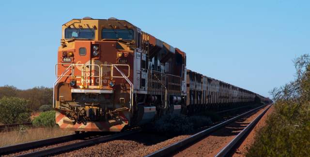 An iron ore train along the rail access road near Newman