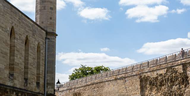 Image shows the exterior of Lincoln Castle.