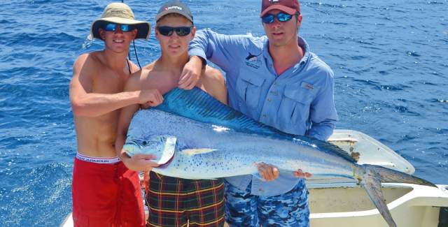Tourists displaying a sport fish caught in Bahia Piñas, Darien Province, Panama.