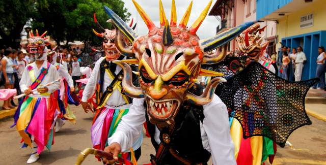 People dressed with diablicos traditional costume and Devil mask