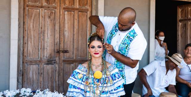 Woman getting ready with typical Panamanian costume "pollera de gala"