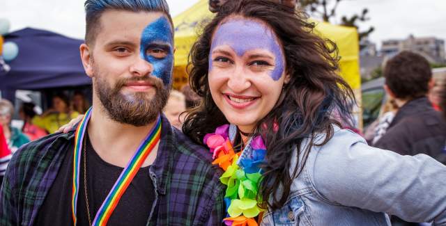 A couple dressed in pride colours at Eastbourne Pride