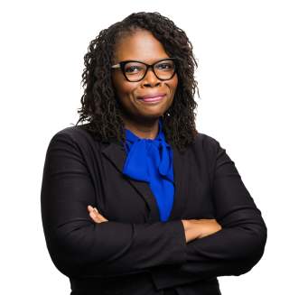 Charlene Slaughter Headshot with city background