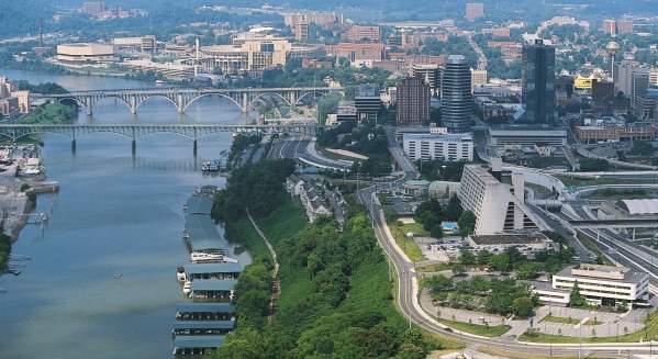 An aerial view of Knoxville Tennessee offers majestic views of the river and the downtown skyline.