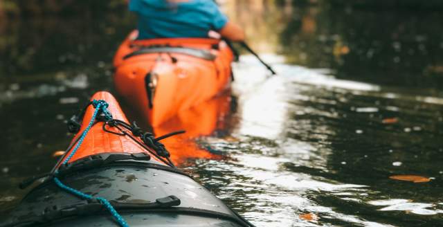 Orange kayaks in the water