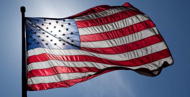 An American flag blowing in the wind