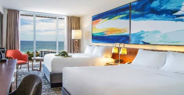 Interior of an oceanfront room with double beds at B Ocean hotel in Fort Lauderdale