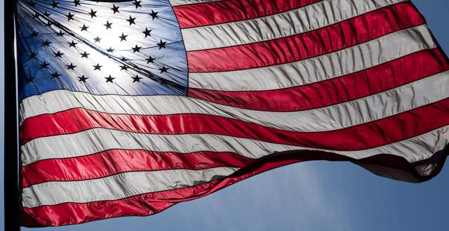 An American flag blowing in the wind