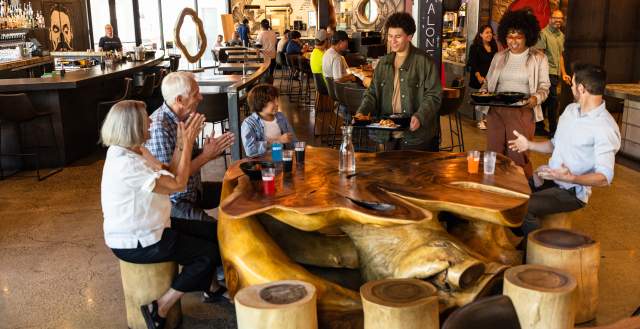 Family eating at the Gatway food hall, the HallPass
