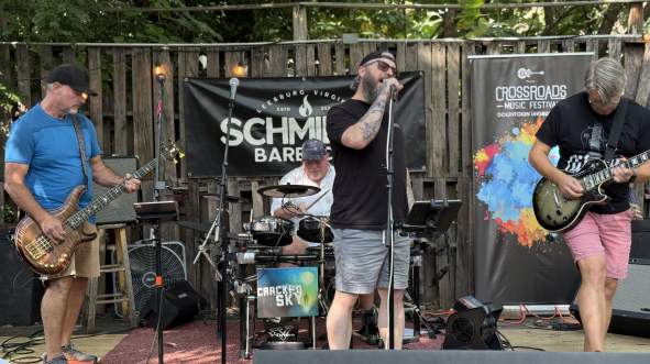 The band Cracked Sky performing for the Crossroads Music Festival in downtown Leesburg.