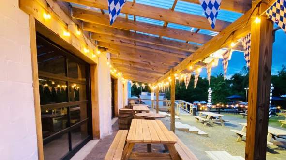 Outdoor Patio with hanging lights at More Better Restaurant & Beer Hall in Round Hill, Virginia.