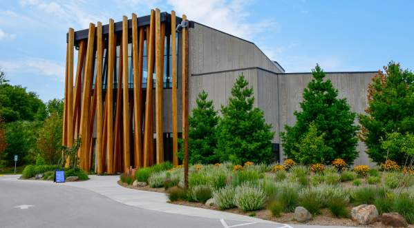 Exterior Photo of the John Michael Kohler Art Preserve featuring tall vertical wood beams, lush landscaping and fully ADA compliant Art Perserve.