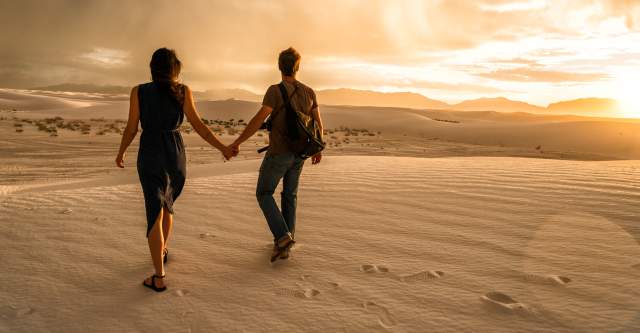White Sands Couple Holding Hands