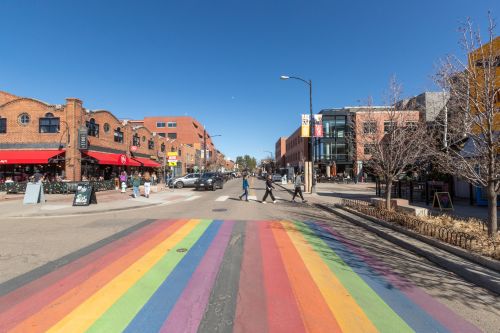 A colorful rainbow crosswalk on West Pearl in Boulder, CO