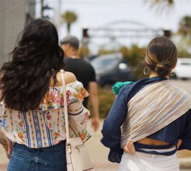 two girls are walking down Reid Avenue in Port St. Joe