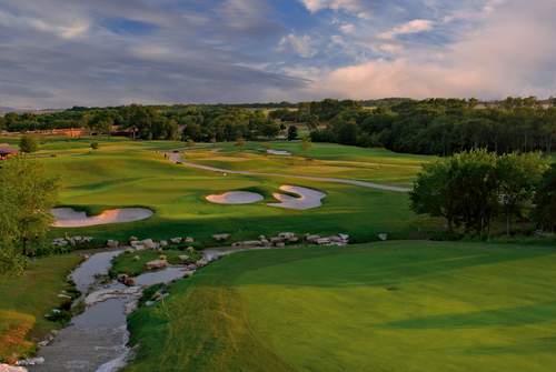 Evening shot of a golf course in McKinney with bright greens and a pink and blue sky